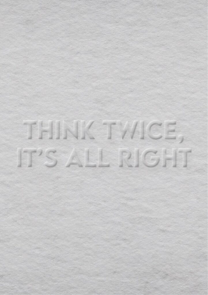 Embossed text on textured paper background: "Think Twice, It's All Right."